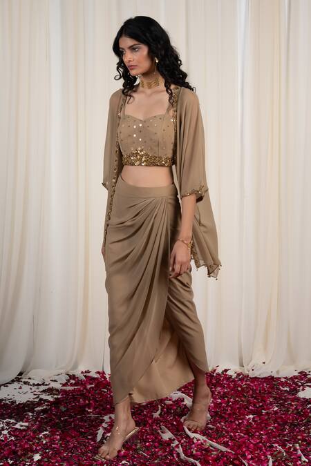 Shop Rirasa Beige Georgette Sequins, Gota Patti Mukuta Embellished Cape Draped Skirt Set at Aza Fashions Shop_Rirasa_Beige Georgette Sequins, Gota Patti Mukuta Embellished Cape Draped Skirt Set_at_Aza_Fashions