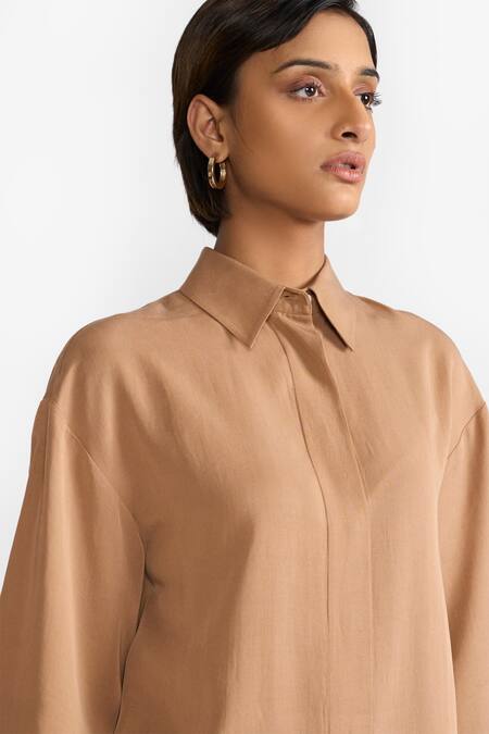 Perona Brown Cotton Solid Collared Blaire Asymmetric Shirt at Aza Fashions Perona_Brown Cotton Solid Collared Blaire Asymmetric Shirt_at_Aza_Fashions