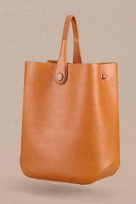 Shop Ampm Brown Cut Work Maira Bucket Bag at Aza Fashions Shop_Ampm_Brown Cut Work Maira Bucket Bag_at_Aza_Fashions