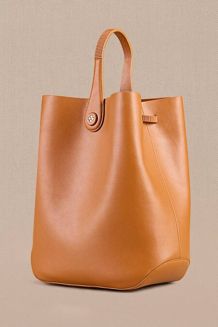 Ampm Brown Cut Work Maira Bucket Bag at Aza Fashions Ampm_Brown Cut Work Maira Bucket Bag_at_Aza_Fashions