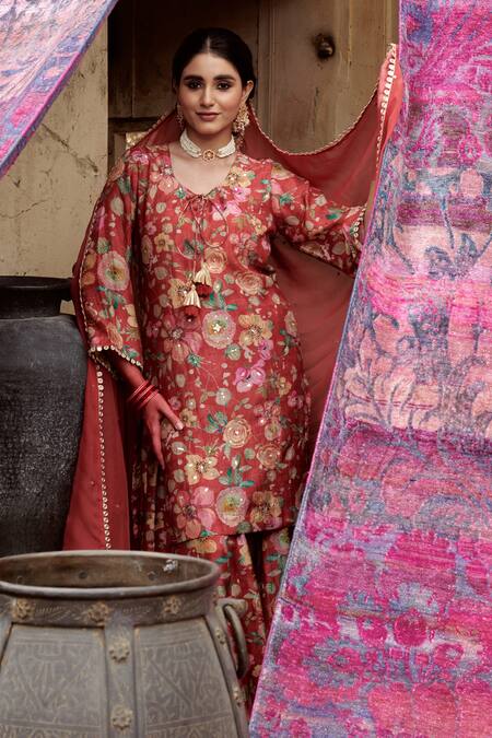 Buy Karaj Jaipur Red Muslin, Organza Tassels, Embroidery, Sequins, Bloom Print Kurta Gharara Set Buy_Karaj Jaipur_Red Muslin, Organza Tassels, Embroidery, Sequins, Bloom Print Kurta Gharara Set