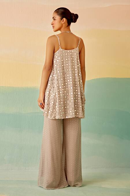 Shop Mustard Moon By Neyha And Vrinda Silver Georgette Mirrors V-neck Embroidered Short Tunic And Flared Pant Set at Aza Fashions Shop_Mustard Moon By Neyha And Vrinda_Silver Georgette Mirrors V-neck Embroidered Short Tunic And Flared Pant Set_at_Aza_Fashions