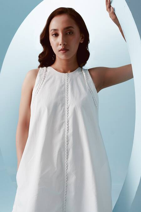 Kavya Singh Kundu White Cotton Embellished Lace Halter Neck Rae Razor Cut Short Dress Online at Aza Fashions Kavya Singh Kundu_White Cotton Embellished Lace Halter Neck Rae Razor Cut Short Dress _Online_at_Aza_Fashions
