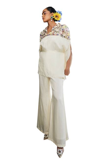 Label Deepshika Agarwal White Silk Fabric Flowers, Embroidery V-neck Floral Top And Flared Pant Set Online at Aza Fashions Label Deepshika Agarwal_White Silk Fabric Flowers, Embroidery V-neck Floral Top And Flared Pant Set _Online_at_Aza_Fashions