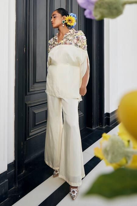 Buy_Label Deepshika Agarwal_White Silk Fabric Flowers, Embroidery V-neck Floral Top And Flared Pant Set _Online_at_Aza_Fashions