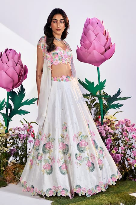 Nea by Nikita Tiwari White Raw Silk Hand Embroidered Lotus Plunge Lehenga Set With Cape