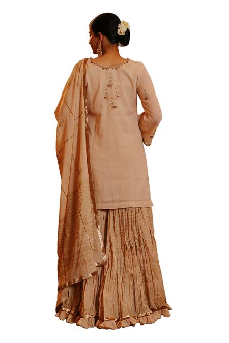 Nazar By Indu Beige Cotton Cut Work, Beads, Embroidery Split V-neck Floret Kurta Gharara Set at Aza Fashions Nazar By Indu_Beige Cotton Cut Work, Beads, Embroidery Split V-neck Floret Kurta Gharara Set _at_Aza_Fashions