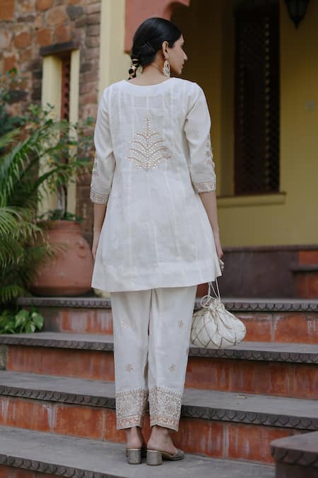 Shop Nazar By Indu White Cotton Gota Patti Round Neck Embroidered Short Kurta Salwar Set at Aza Fashions Shop_Nazar By Indu_White Cotton Gota Patti Round Neck Embroidered Short Kurta Salwar Set _at_Aza_Fashions