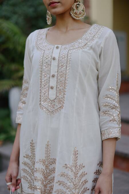 Shop Nazar By Indu White Cotton Gota Patti Round Neck Embroidered Short Kurta Salwar Set Shop_Nazar By Indu_White Cotton Gota Patti Round Neck Embroidered Short Kurta Salwar Set