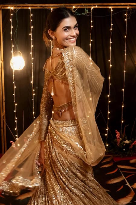 Buy_Isa By Dolly Wahal_Gold Net Sequins, Cut Work V-neck Icarus Embroidered Lehenga Set _Online_at_Aza_Fashions