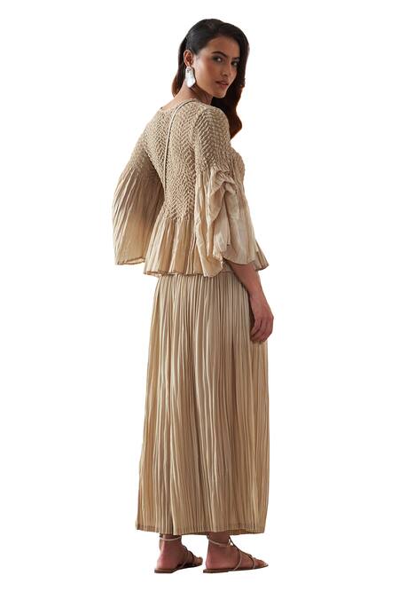 Pleats By Aruni Beige Round Neck Pleated Top And Culotte Pant Set at Aza Fashions Pleats By Aruni_Beige Round Neck Pleated Top And Culotte Pant Set _at_Aza_Fashions