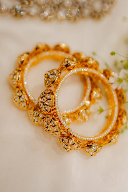 Shop Ekathva Jaipur Gold Plated Imitation Diamonds Ciara Polki Studded Pacheli Bangles-Set of 2 at Aza Fashions Shop_Ekathva Jaipur_Gold Plated Imitation Diamonds Ciara Polki Studded Pacheli Bangles-Set of 2_at_Aza_Fashions