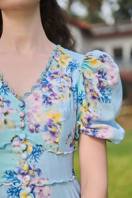 Verano By Tanya Blue Cotton, Linen Embroidery V-neck Marina Floral Print Flared Dress at Aza Fashions Verano By Tanya_Blue Cotton, Linen Embroidery V-neck Marina Floral Print Flared Dress _at_Aza_Fashions