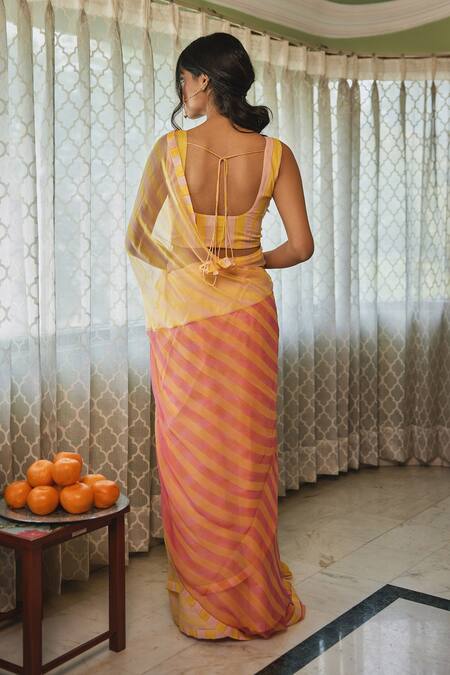 Shop Kapraaaha Yellow Chiffon Embroidery Round Neck Contrast Pallu Printed Saree With Blouse at Aza Fashions Shop_Kapraaaha_Yellow Chiffon Embroidery Round Neck Contrast Pallu Printed Saree With Blouse_at_Aza_Fashions
