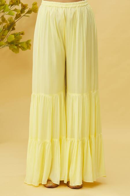 Samyukta Singhania_Yellow Bamboo, Silk, Chiffon Cut Work, Sequins, Floral Peplum Top Sharara Set_at_Aza_Fashions