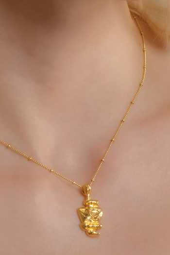 Buy Arvino Gold Plated Patrimony Totem Carved Charm Necklace at Aza Fashions Buy_Arvino_Gold Plated Patrimony Totem Carved Charm Necklace _at_Aza_Fashions