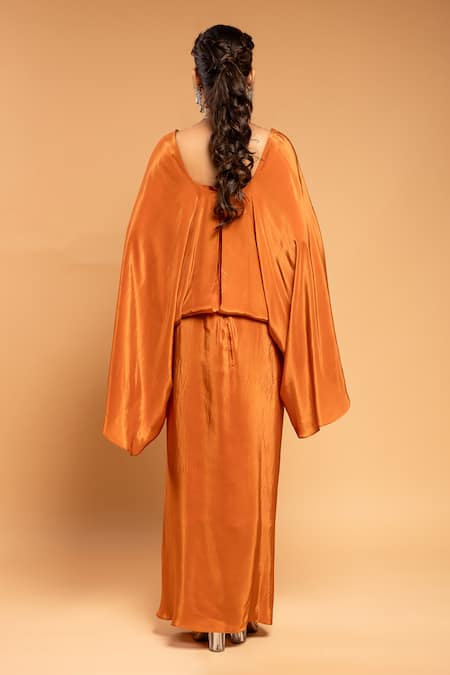 Shop Ellemora Fashions Orange Natural Crepe Solid V Neck Draped Maxi Dress at Aza Fashions Shop_Ellemora Fashions_Orange Natural Crepe Solid V Neck Draped Maxi Dress _at_Aza_Fashions