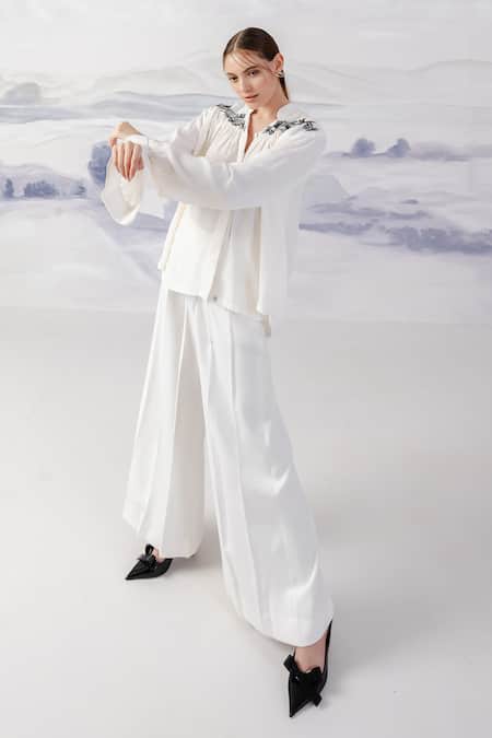Buy_Orthodox_White Banana Crepe Flared Solid Trouser _Online_at_Aza_Fashions