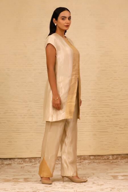 Eeda Ivory Silk, Tissue Patchwork Crew Neck Center Slit Short Kurta And Pant Set Online at Aza Fashions Eeda_Ivory Silk, Tissue Patchwork Crew Neck Center Slit Short Kurta And Pant Set _Online_at_Aza_Fashions
