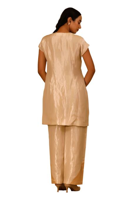 Shop Eeda Ivory Silk, Tissue Patchwork Crew Neck Center Slit Short Kurta And Pant Set Online at Aza Fashions Shop_Eeda_Ivory Silk, Tissue Patchwork Crew Neck Center Slit Short Kurta And Pant Set _Online_at_Aza_Fashions