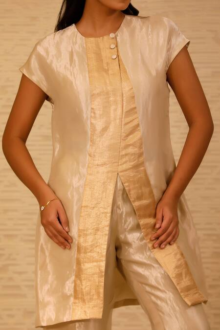 Eeda Ivory Silk, Tissue Patchwork Crew Neck Center Slit Short Kurta And Pant Set at Aza Fashions Eeda_Ivory Silk, Tissue Patchwork Crew Neck Center Slit Short Kurta And Pant Set _at_Aza_Fashions