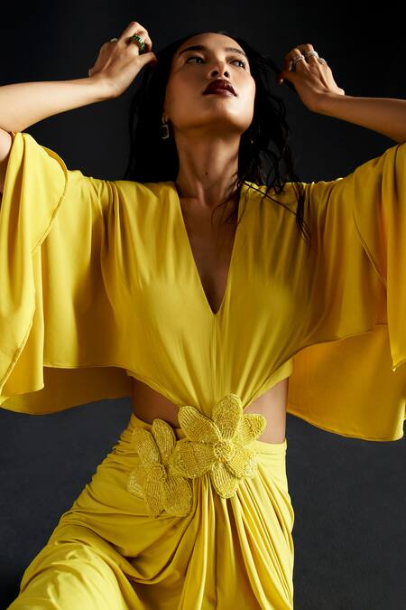 Buy Manika Nanda Yellow Lycra Embroidery Plunge Neck 3d Buttercup Bloom Embellished Gown Online at Aza Fashions Buy_Manika Nanda_Yellow Lycra Embroidery Plunge Neck 3d Buttercup Bloom Embellished Gown _Online_at_Aza_Fashions