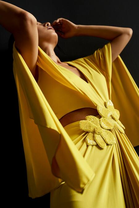 Manika Nanda Yellow Lycra Embroidery Plunge Neck 3d Buttercup Bloom Embellished Gown at Aza Fashions Manika Nanda_Yellow Lycra Embroidery Plunge Neck 3d Buttercup Bloom Embellished Gown _at_Aza_Fashions