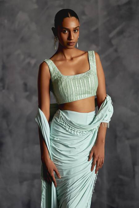 Manika Nanda Blue Silk, Lycra Nalki Tassel Embellished Border Pre-draped Saree With Blouse Online at Aza Fashions Manika Nanda_Blue Silk, Lycra Nalki Tassel Embellished Border Pre-draped Saree With Blouse _Online_at_Aza_Fashions