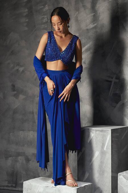 Manika Nanda Blue Silk, Lycra Sequins, Cut Gardenia Embroidered Blouse Draped Skirt Set at Aza Fashions Manika Nanda_Blue Silk, Lycra Sequins, Cut Gardenia Embroidered Blouse Draped Skirt Set _at_Aza_Fashions