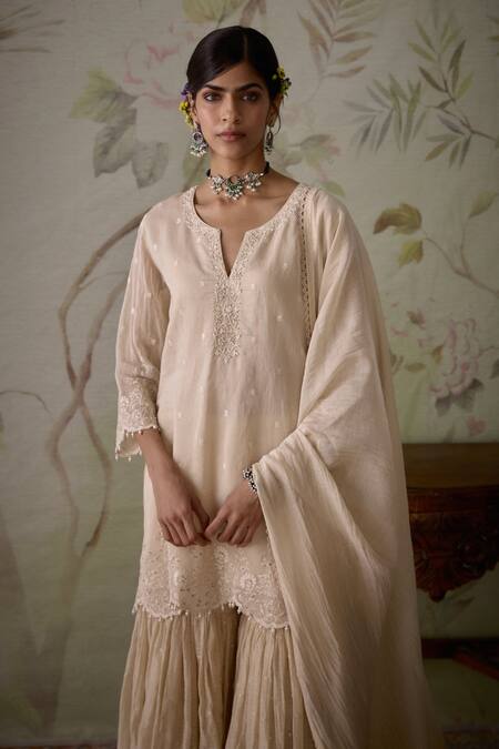 Kritika Dawar Ivory Chanderi Embroidery, Pearls V-neck Floral Short Kurta Gharara Set at Aza Fashions Kritika Dawar_Ivory Chanderi Embroidery, Pearls V-neck Floral Short Kurta Gharara Set _at_Aza_Fashions
