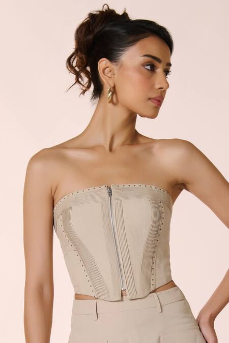 S&N By Shantnu Nikhil Beige Lycra, Rayon Rhinestones Off-shoulder Rivet Embellished Corset Top Online at Aza Fashions S&N By Shantnu Nikhil_Beige Lycra, Rayon Rhinestones Off-shoulder Rivet Embellished Corset Top_Online_at_Aza_Fashions