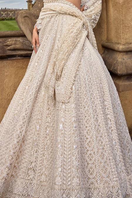 Seema Gujral Ivory Net Pearls, Sequins, Embroidery Plunge Neck Thread Bridal Lehenga Set at Aza Fashions Seema Gujral_Ivory Net Pearls, Sequins, Embroidery Plunge Neck Thread Bridal Lehenga Set _at_Aza_Fashions