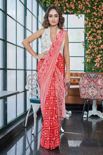 Buy SAYISHA Red Crepe Embroidery, Sequins, Geometric Print Pre-draped Saree With Blouse at Aza Fashions Buy_SAYISHA_Red Crepe Embroidery, Sequins, Geometric Print Pre-draped Saree With Blouse_at_Aza_Fashions