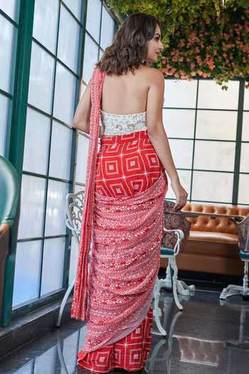 Shop SAYISHA Red Crepe Embroidery, Sequins, Geometric Print Pre-draped Saree With Blouse at Aza Fashions Shop_SAYISHA_Red Crepe Embroidery, Sequins, Geometric Print Pre-draped Saree With Blouse_at_Aza_Fashions