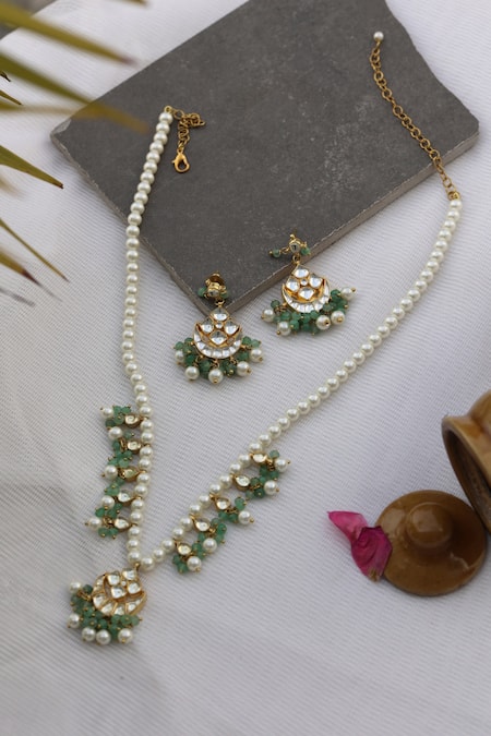 Shop Do Taara Gold Plated Pearls, Diamonds, Stones Crescent Cutwork Pendant Necklace Set at Aza Fashions Shop_Do Taara_Gold Plated Pearls, Diamonds, Stones Crescent Cutwork Pendant Necklace Set _at_Aza_Fashions