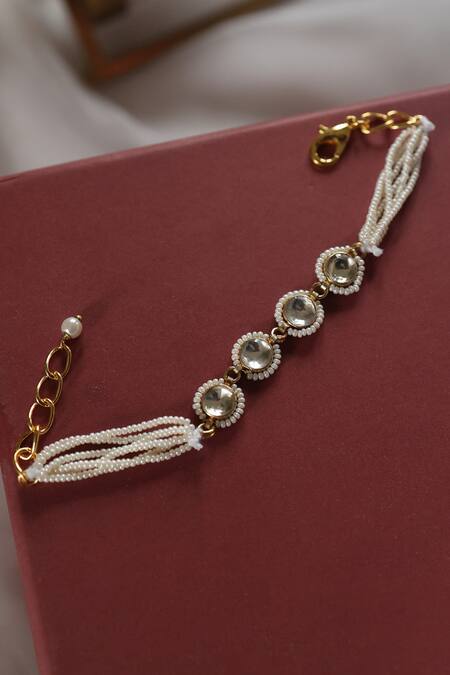 Shop Do Taara Gold Plated Crystals, Pearls Kundan Embellished Bracelet at Aza Fashions Shop_Do Taara_Gold Plated Crystals, Pearls Kundan Embellished Bracelet _at_Aza_Fashions