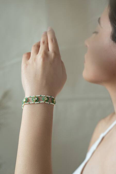 Do Taara Green Crystals, Pearls Kundan Embellished Cutwork Bracelet Online at Aza Fashions Do Taara_Green Crystals, Pearls Kundan Embellished Cutwork Bracelet _Online_at_Aza_Fashions