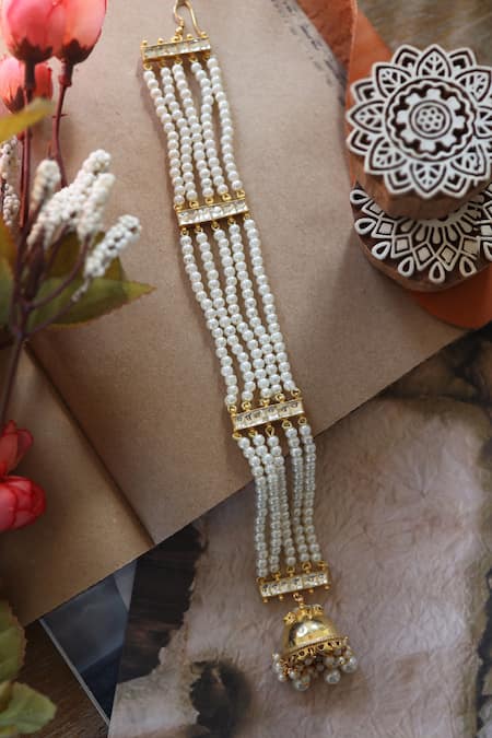 Shop Do Taara Gold Plated Pearls And Kundan Embellished Multistrand Braid Pin at Aza Fashions Shop_Do Taara_Gold Plated Pearls And Kundan Embellished Multistrand Braid Pin _at_Aza_Fashions