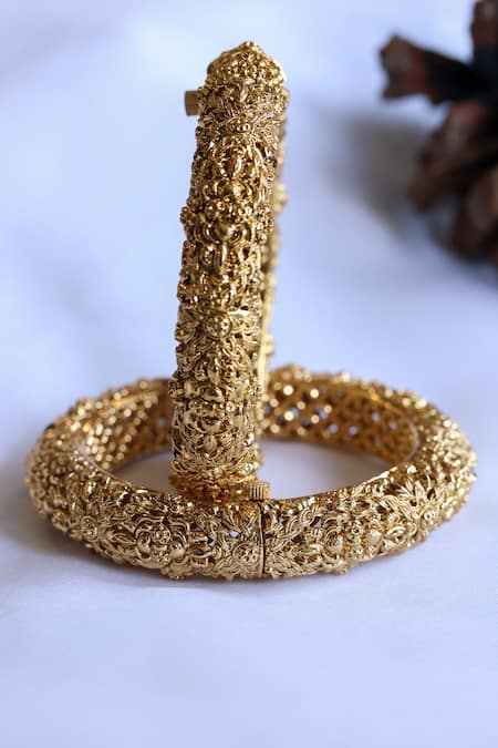 Shop_Do Taara_Gold Plated Cut Work Carved Floral Temple Bangles-Set of 2 _at_Aza_Fashions