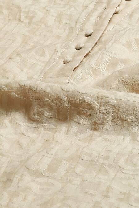 Abraham And Thakore_Beige Chanderi Cut Work Round Neck Calligraphy A Line Kurta _at_Aza_Fashions