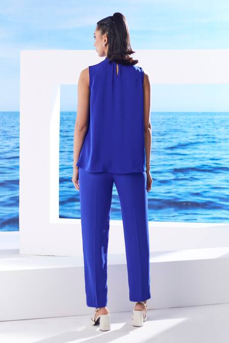 Shop House Of Zeniaa Blue Crepe Fabric Flowers Ibiza Embellished Top And Pant Set at Aza Fashions Shop_House Of Zeniaa_Blue Crepe Fabric Flowers Ibiza Embellished Top And Pant Set_at_Aza_Fashions