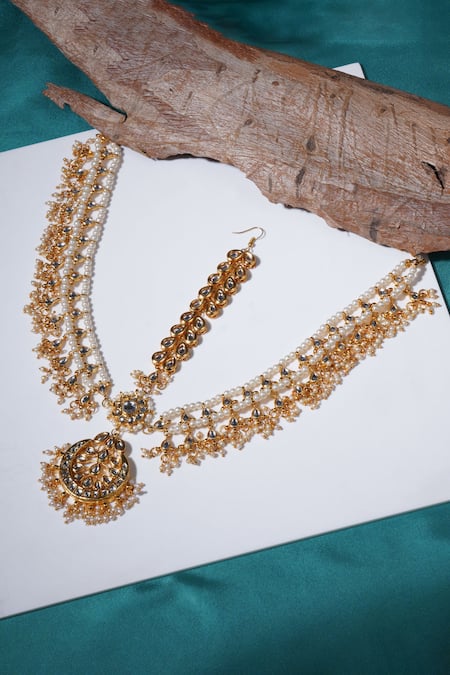 Shop Ruby Raang Gold Plated Kundan And Pearl Embellished Mathapatti at Aza Fashions Shop_Ruby Raang_Gold Plated Kundan And Pearl Embellished Mathapatti _at_Aza_Fashions