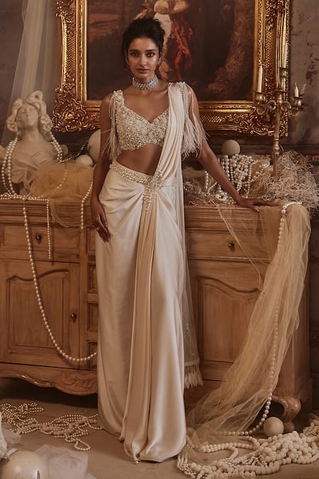 Shop Roqa Ivory Modal, Net Pearls, Perseus Embroidered Pre-draped Saree With Blouse Online at Aza Fashions Shop_Roqa_Ivory Modal, Net Pearls, Perseus Embroidered Pre-draped Saree With Blouse _Online_at_Aza_Fashions