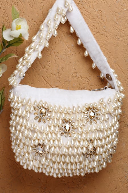 Shop Bijoux By Priya Chandna White Pearls Velvet Tassel Button Up Potli at Aza Fashions Shop_Bijoux By Priya Chandna_White Pearls Velvet Tassel Button Up Potli _at_Aza_Fashions