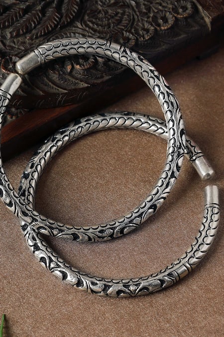 Shop Mero Jewellery Silver Plated Floral Carved Leg Kada - Set Of 2 at Aza Fashions Shop_Mero Jewellery_Silver Plated Floral Carved Leg Kada - Set Of 2 _at_Aza_Fashions