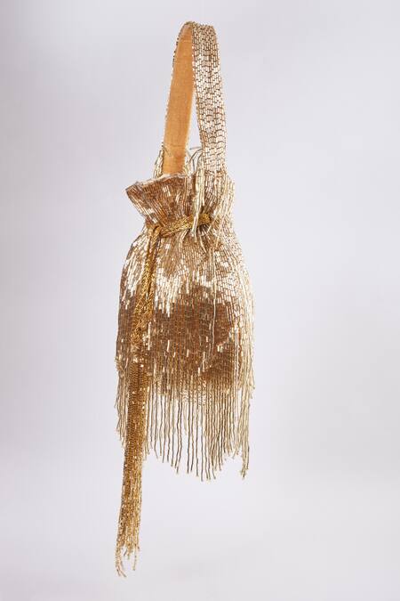 Buy Tasna Gold Cutdana Cosmic Haze Tassel Potli Bag Online at Aza Fashions Buy_Tasna_Gold Cutdana Cosmic Haze Tassel Potli Bag _Online_at_Aza_Fashions