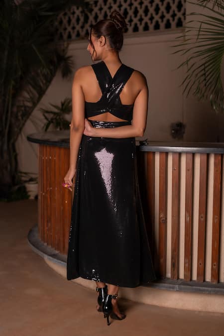 Shop Label Anshu Khathuria Black Georgette Sequins, Fabric Flowers Halter Neck Detailed Midi Dress at Aza Fashions Shop_Label Anshu Khathuria_Black Georgette Sequins, Fabric Flowers Halter Neck Detailed Midi Dress _at_Aza_Fashions