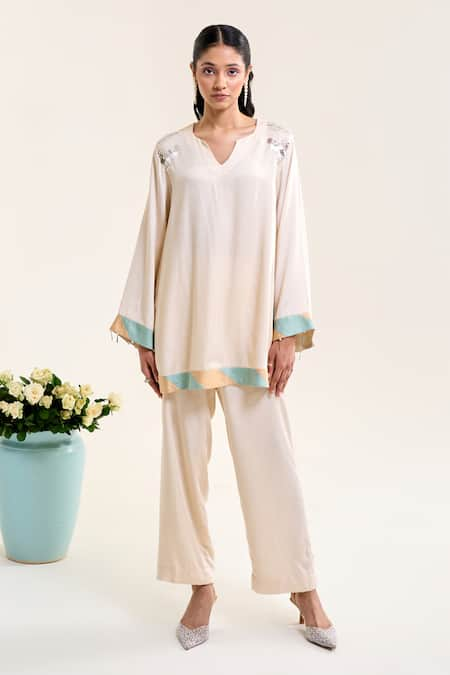 Siyona by Ankurita Ivory Satin Hand Embroidery Sequin Notched Lily Short Kurta And Pant Co-ord Set 