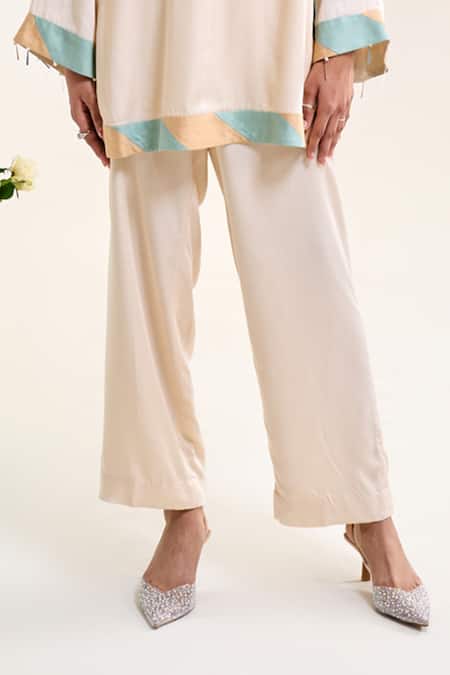 Siyona By Ankurita Ivory Satin Sequins, Embroidery Round Neck Lily Short Kurta And Pant Co-ord Set Online at Aza Fashions Siyona By Ankurita_Ivory Satin Sequins, Embroidery Round Neck Lily Short Kurta And Pant Co-ord Set _Online_at_Aza_Fashions