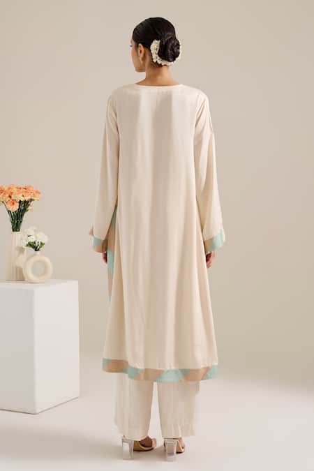 Shop Siyona By Ankurita Ivory Satin Sequins Round Neck Lily Shoulder Embroidered Kurta Set at Aza Fashions Shop_Siyona By Ankurita_Ivory Satin Sequins Round Neck Lily Shoulder Embroidered Kurta Set _at_Aza_Fashions